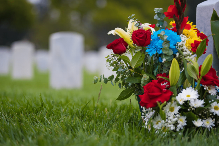 A mixture of flowers placed at a grave after a wrongful death.