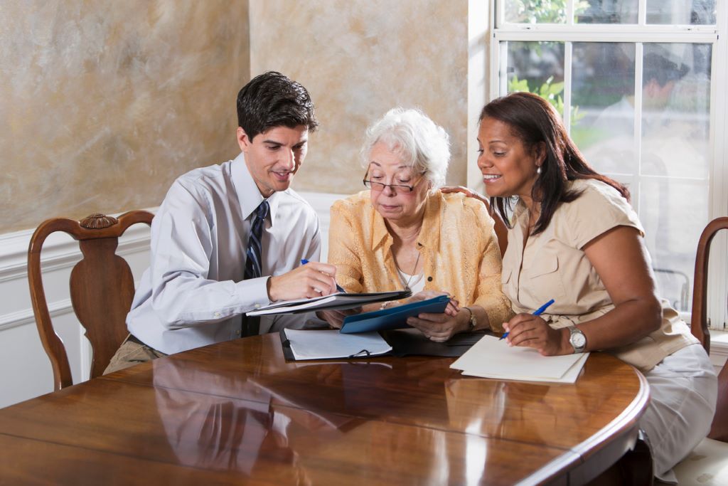 loved one discussing her will with an attorney