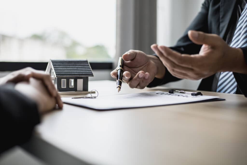 Closeup of a lawyer discussing a contract with his client.