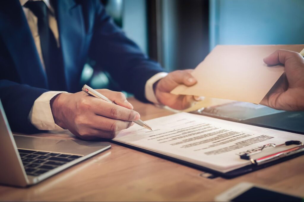wrongful death attorney meeting with a client going over paperwork
