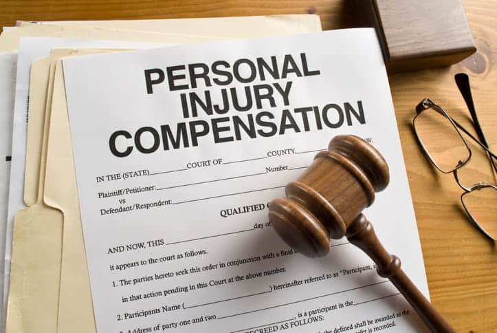 A form that reads: "Personal Injury Compensation" with a gavel over it. 