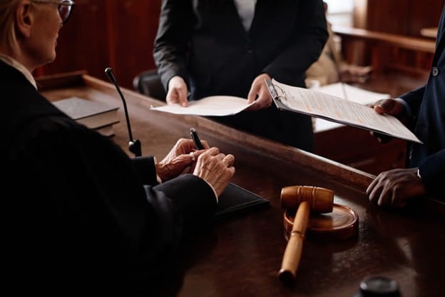 Two laywers present their case to a judge.
